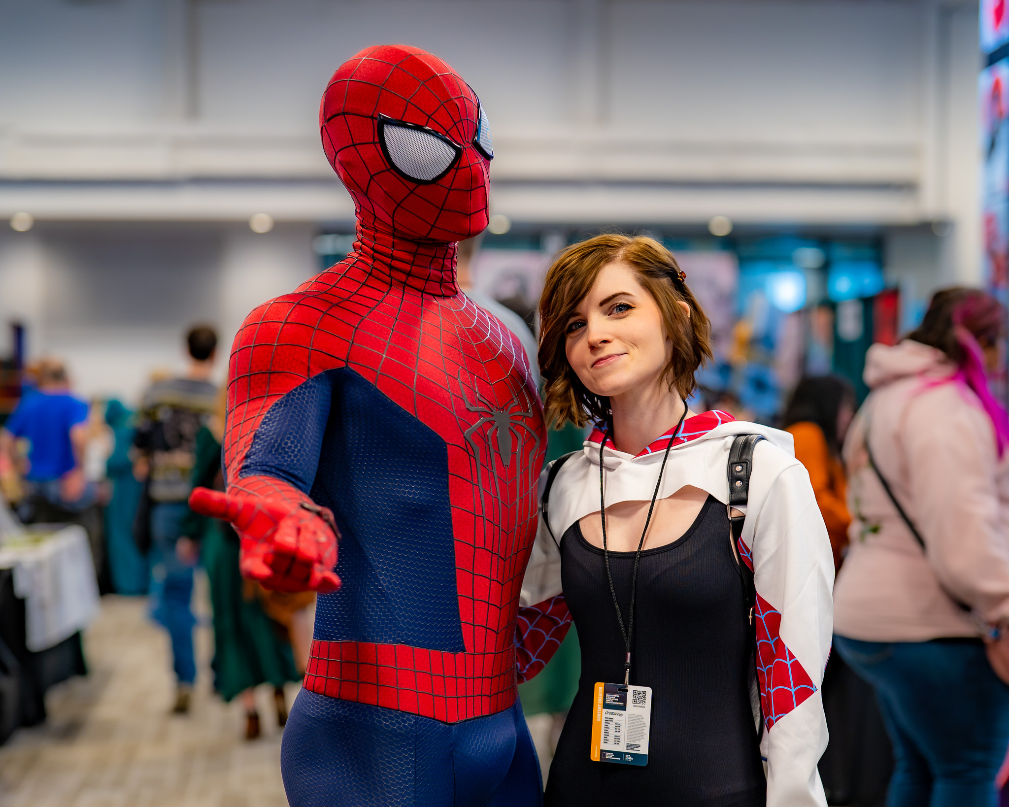 Spider-Man and a cosplayer posing together at a convention