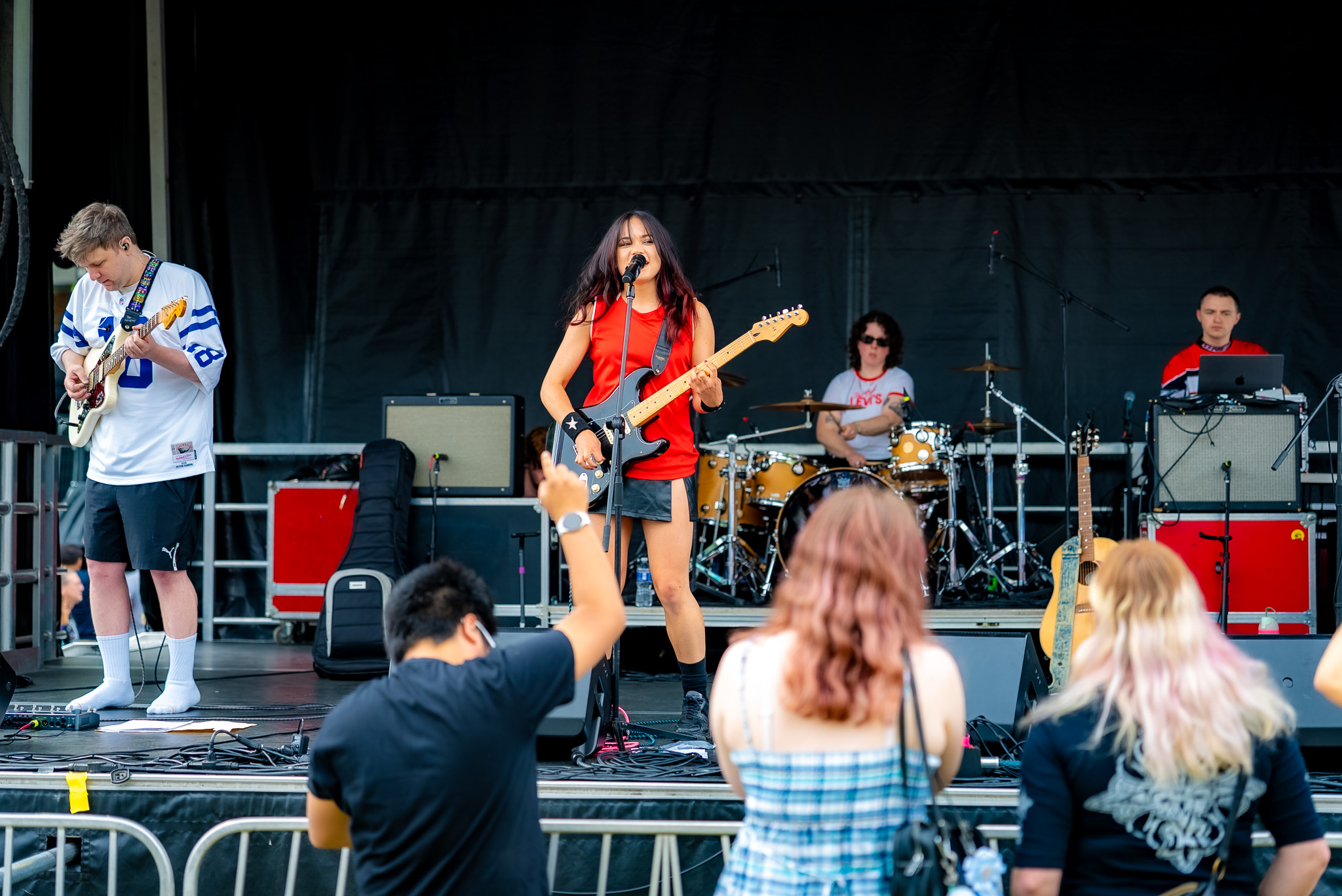 Band filling an outdoor festival stage