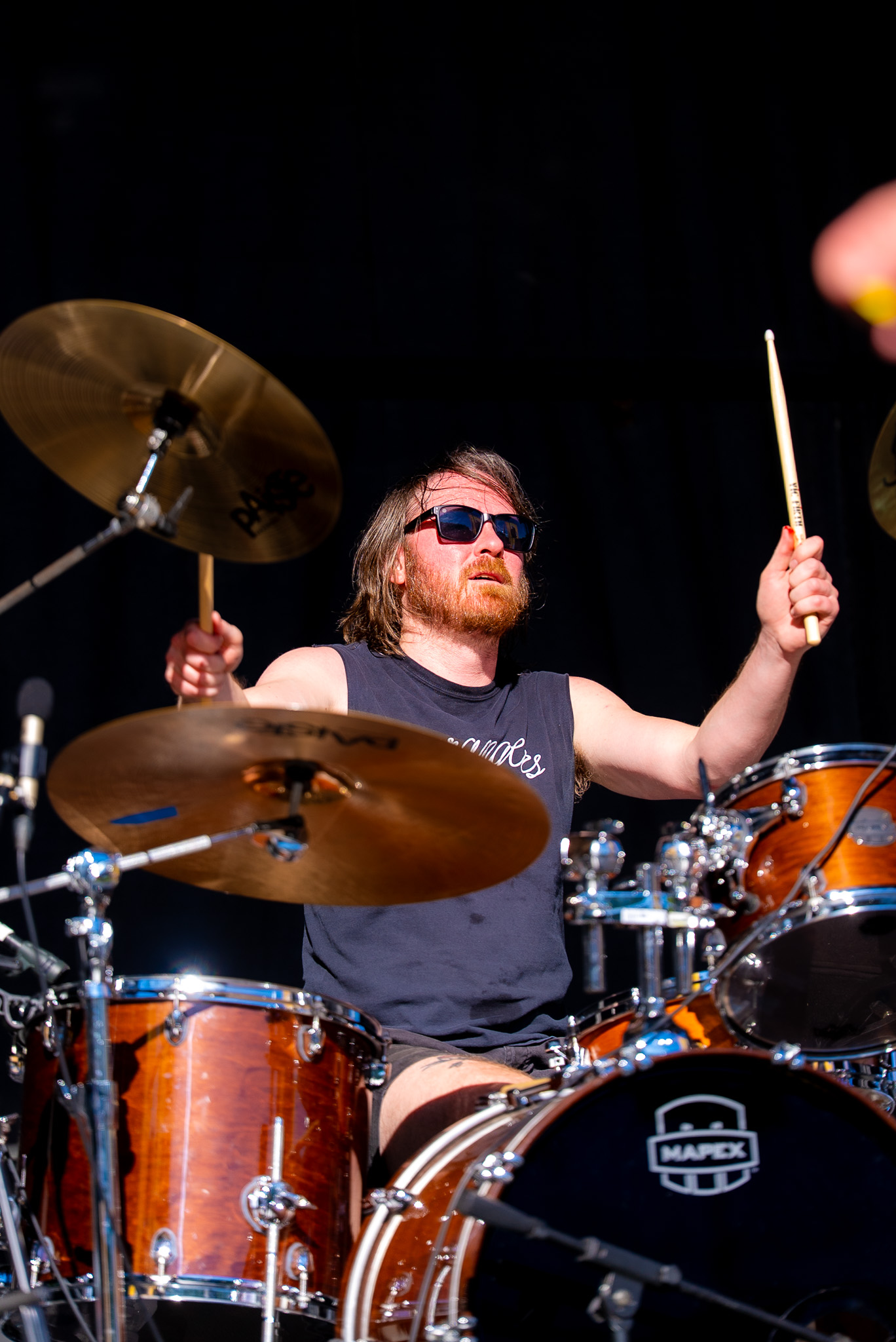Drummer performing during a local set