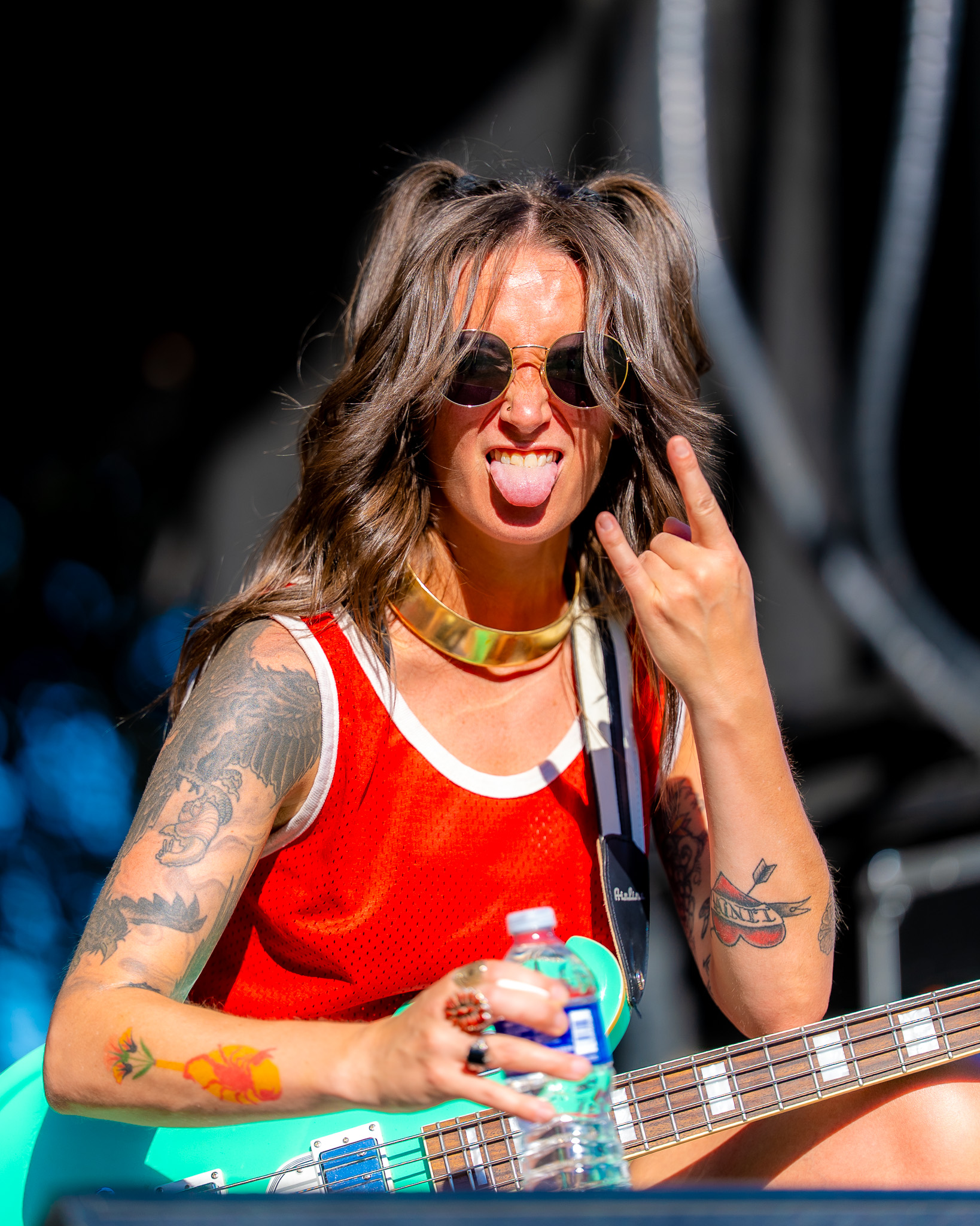 Bassist performing at the outdoor festival