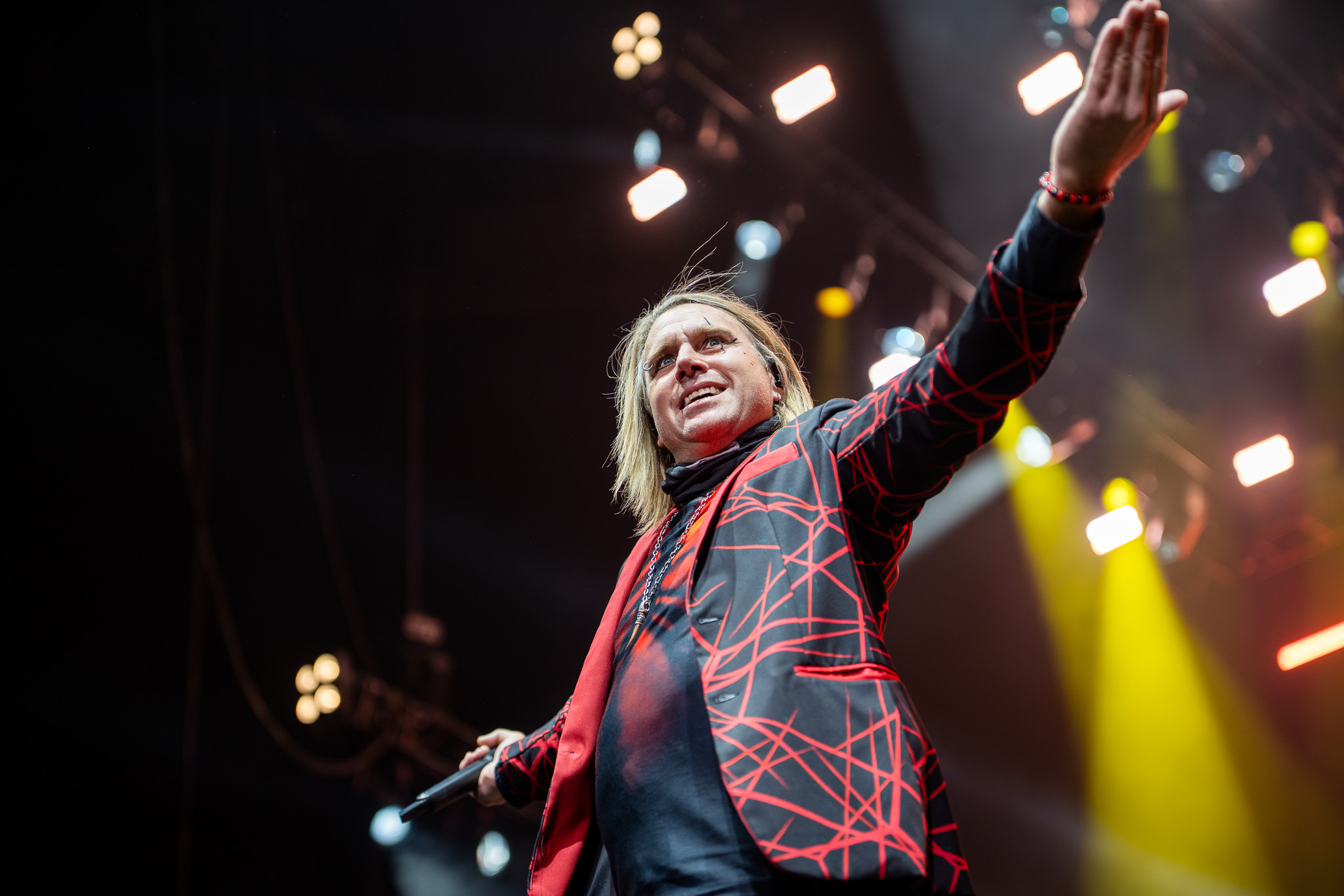 Three Days Grace vocalist with an arm raised