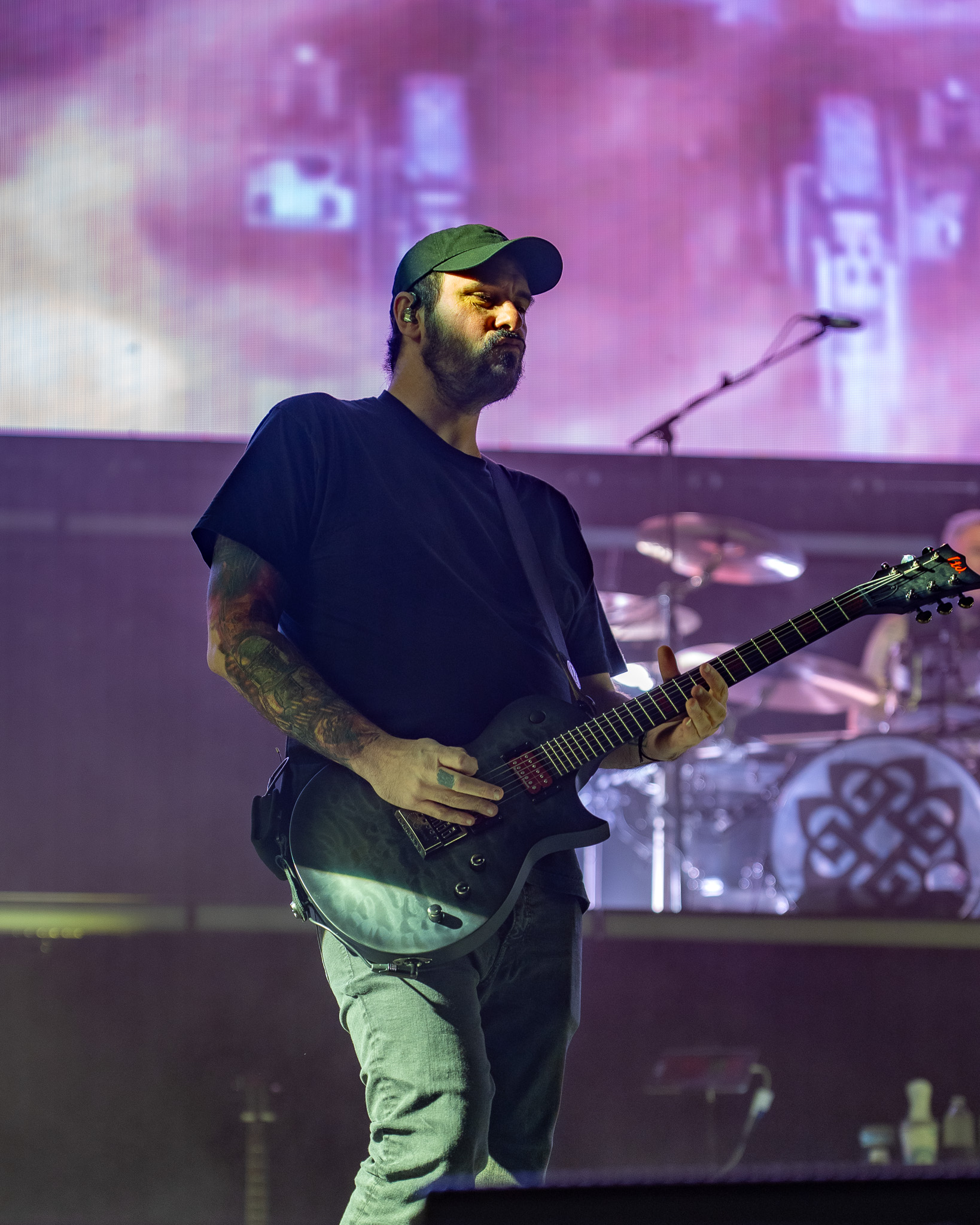 Breaking Benjamin musician under stage light