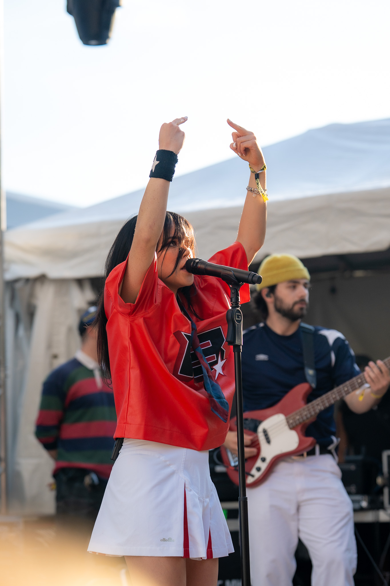 Juliet Daniel performing in a red jersey at Bumbershoot
