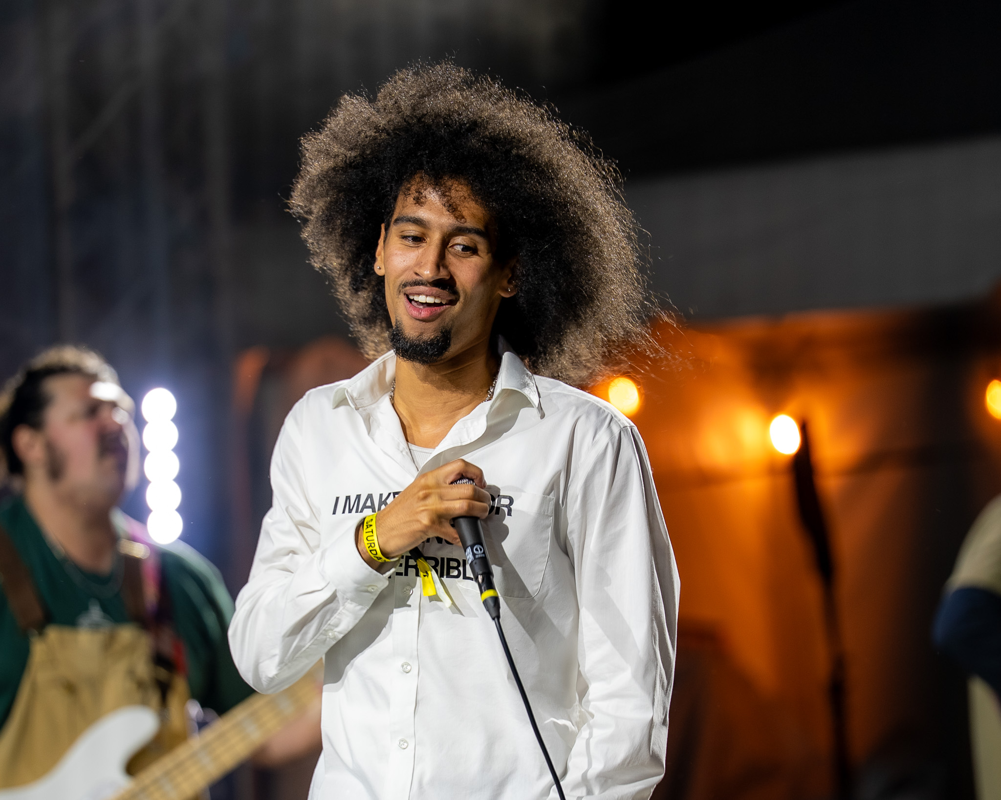 Oblé Reed smiling between verses at Bumbershoot