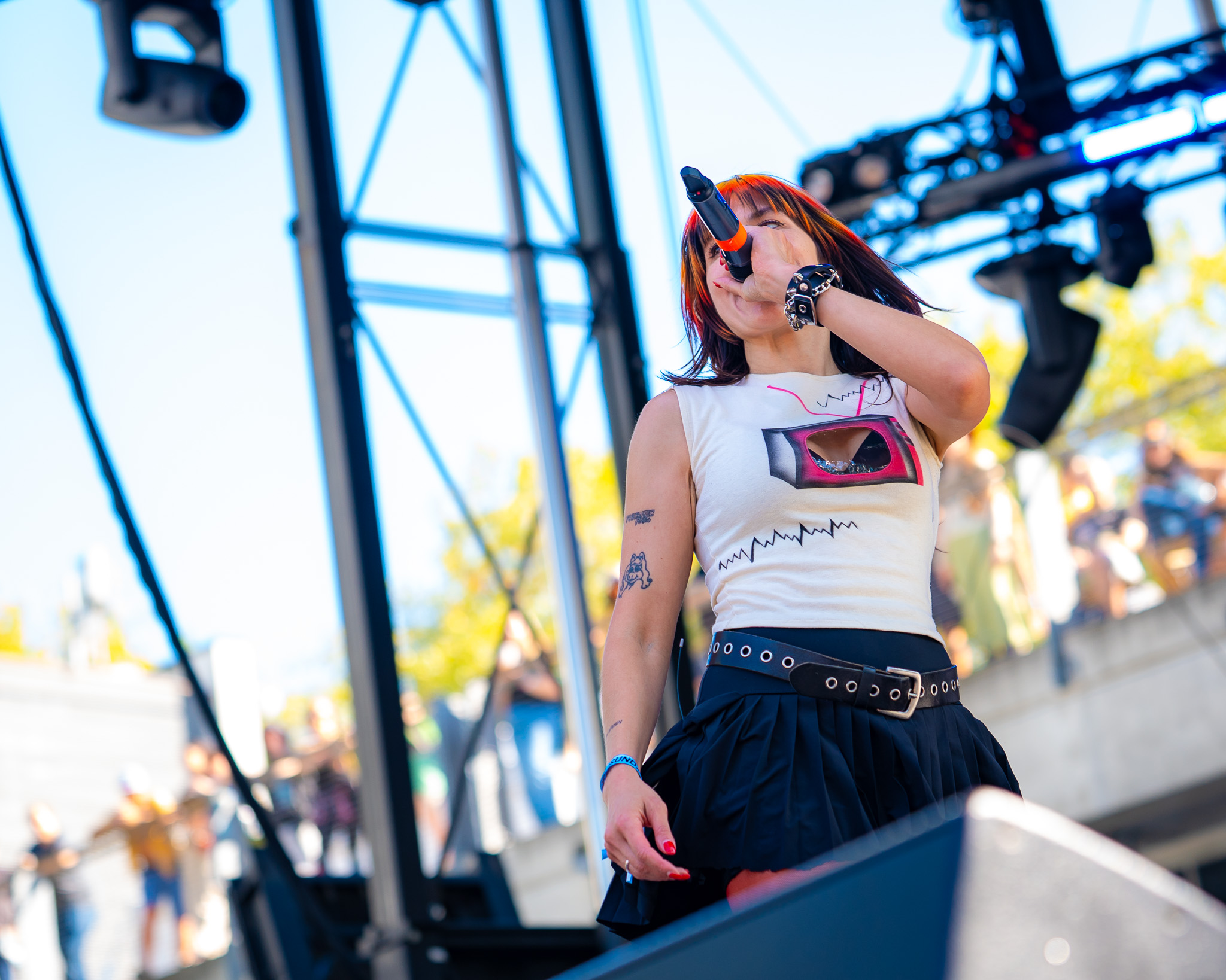 Melissa Scaduto singing beneath the Bumbershoot stage rig