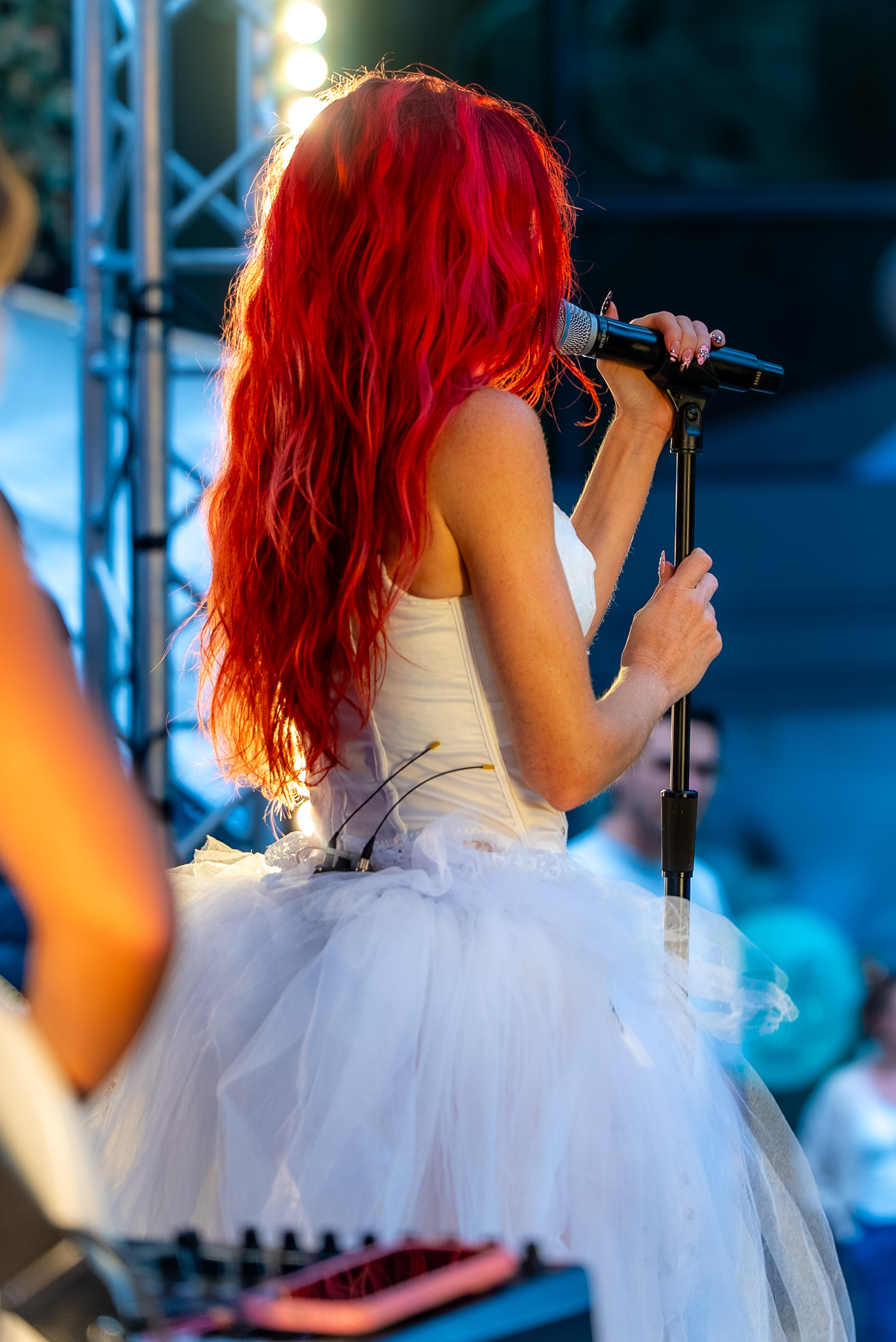 Cherry Bomb performing beneath the stage backdrop