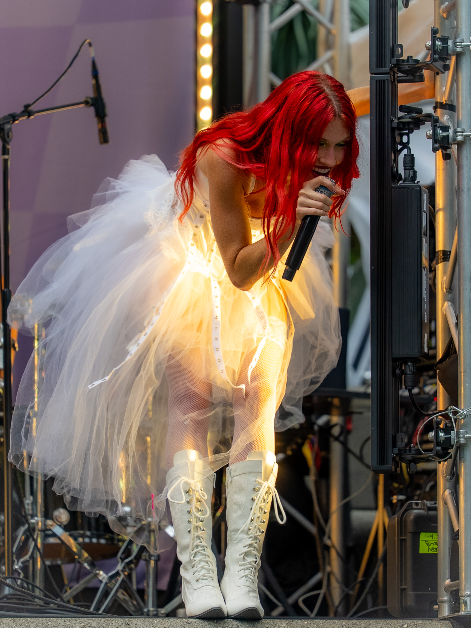 Mandy Lee holding the microphone during her Cherry Bomb set