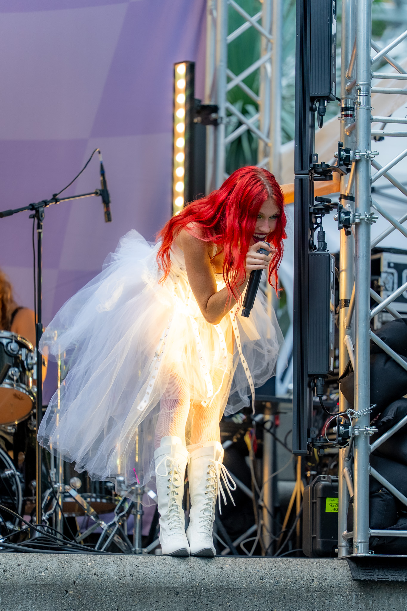 Cherry Bomb performing against a graphic backdrop