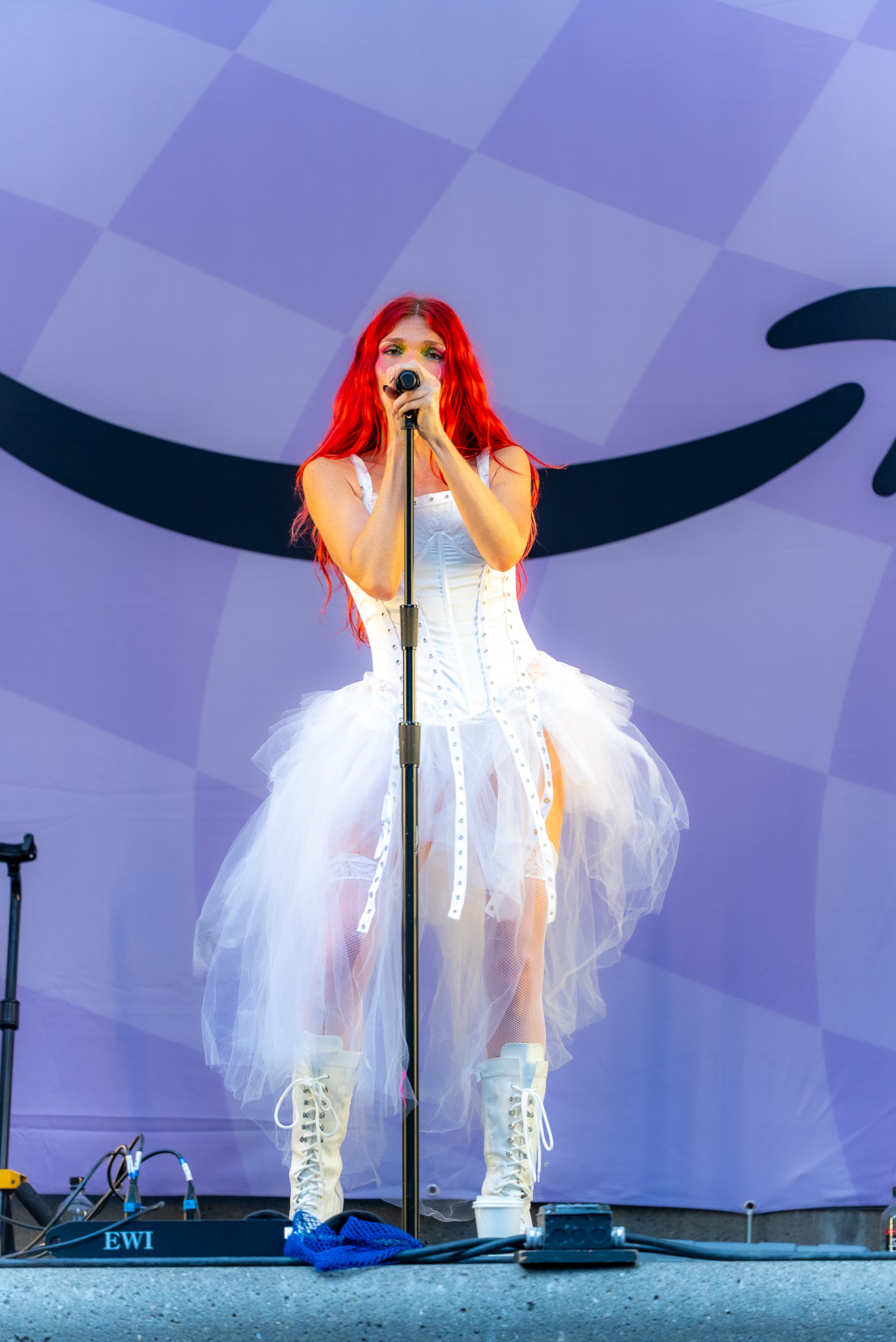 Cherry Bomb in a full-length performance portrait
