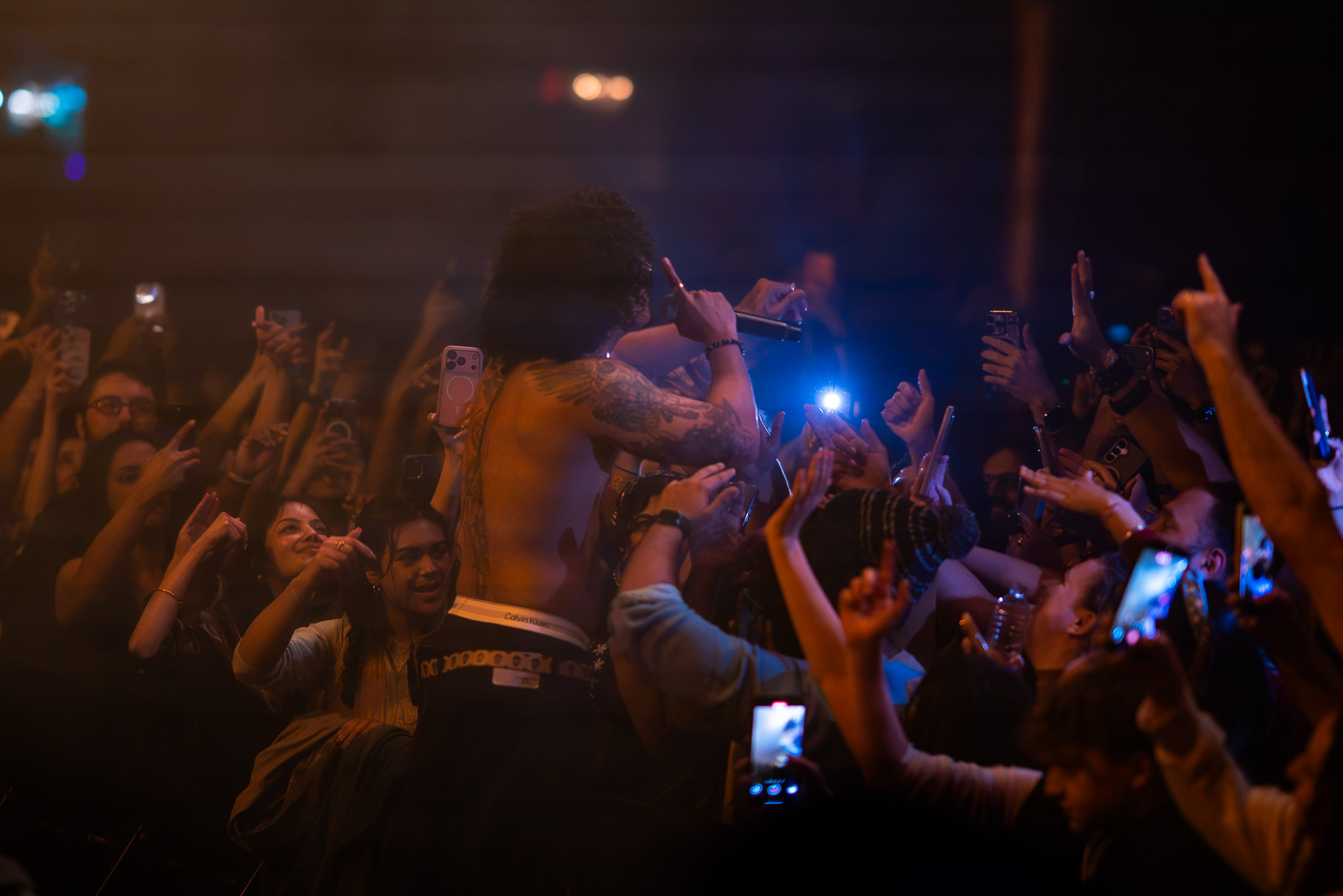 Hanumankind performing among the crowd at the Showbox