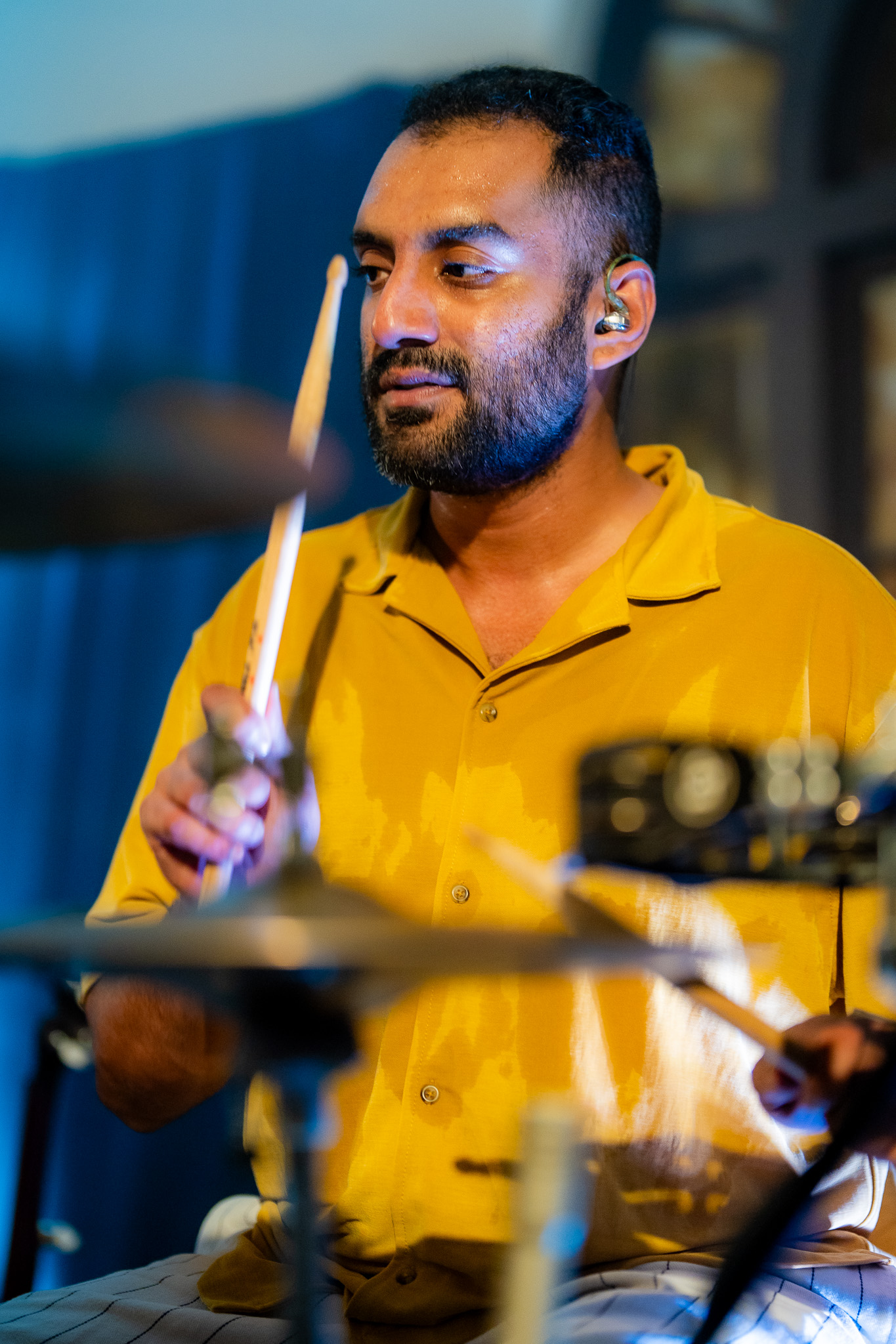 The drummer for When Chai Met Toast plays in a bright yellow shirt